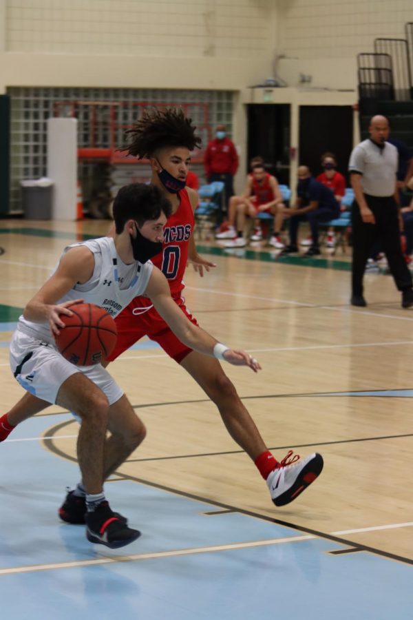Ortiz 21 drives to the basket on a Raiders fast break