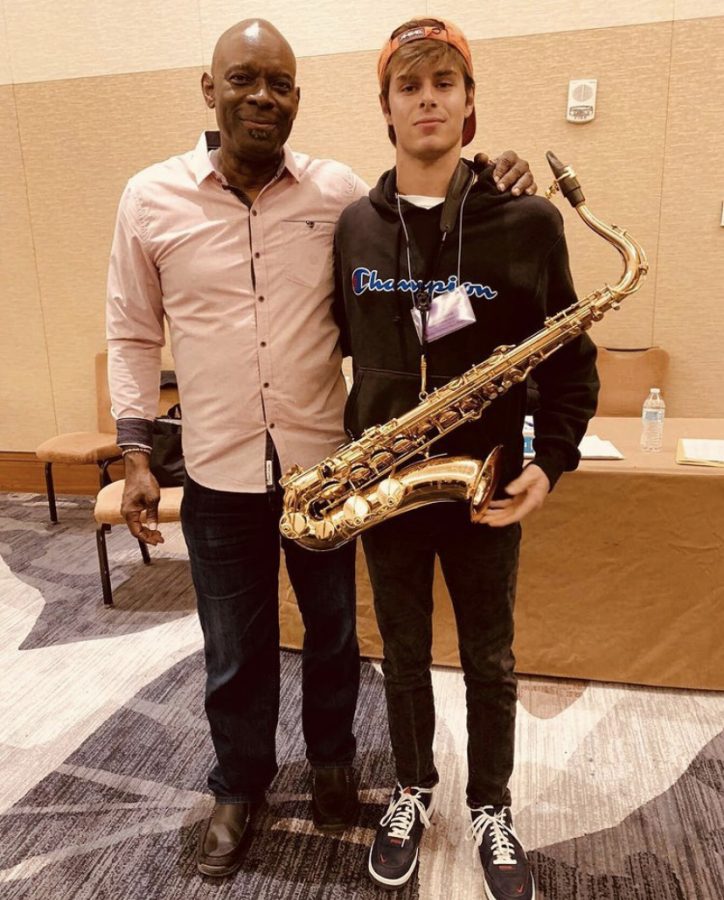 Munroe standing with Ron McCurdy, a Professor of Music at the University of South Carolina