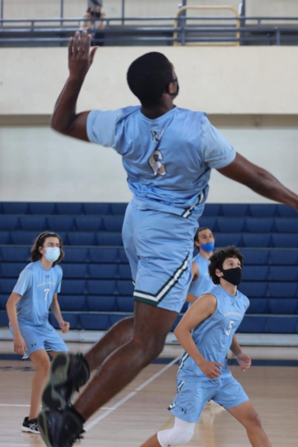 De'vonte Payton ‘22 spiking the ball during the third set. 