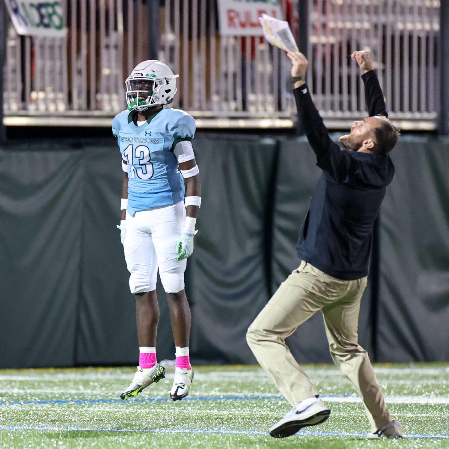 Kaige Brown 25 and coach Jake Caron celebrating their victory.