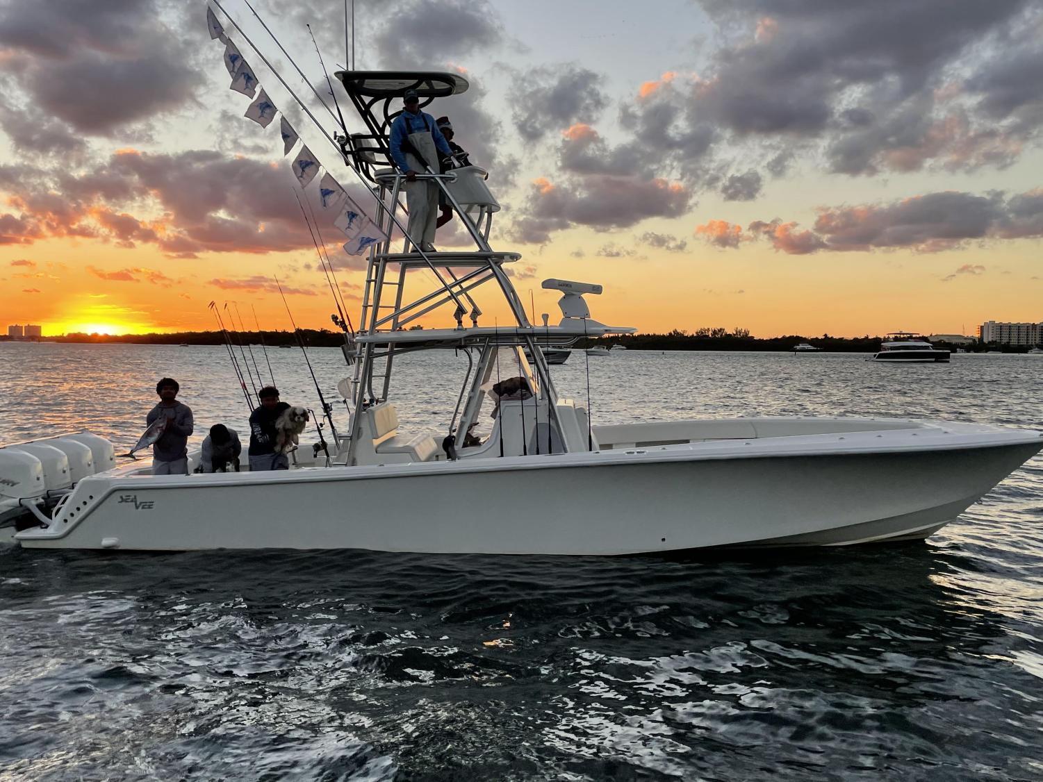 Clayton Younger ’23 (top) going out on his fishing boat in the early morning.