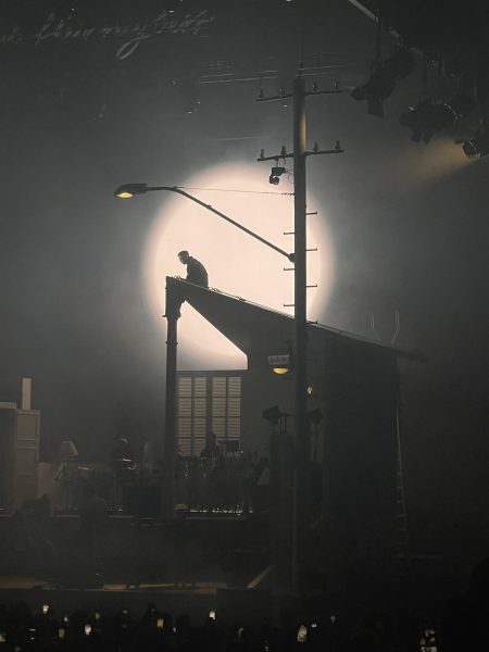 Healy makes his way to the roof of the house, where the set realistically mirrors a street at night. 