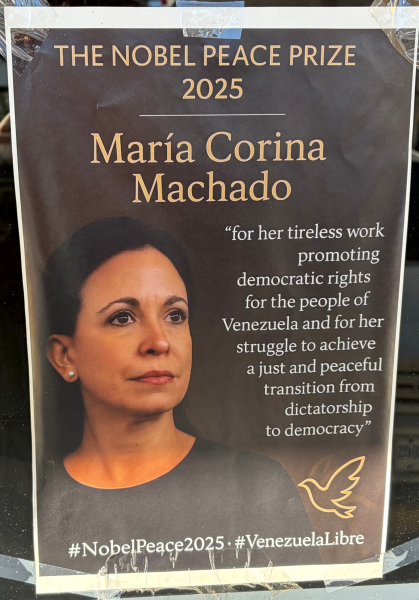 A sign commending Venezuelan opposition leader Maria Machado, posted outside a Venezuelan arepas restaurant in Doral
